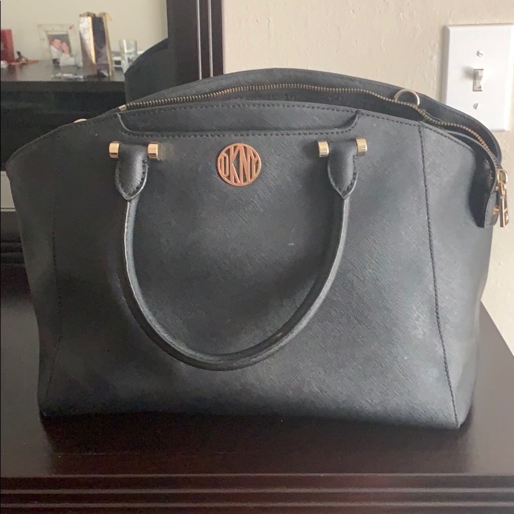 Authentic black leather DKNY purse w/ gold marking